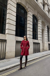 a lady in a red tweed dress